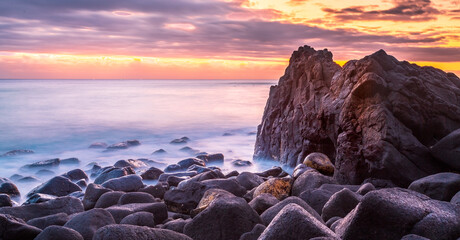 Coastal rocks in the light before sunrise at Burleigh Heads, Queensland, Australia - Powered by Adobe