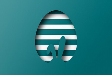 Green paper cut to form an Easter egg pattern.