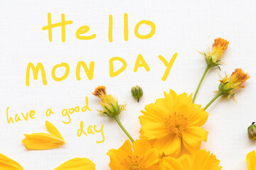 hello monday have a good day message card handwriting with yellow flower cosmos arrangement hearts...