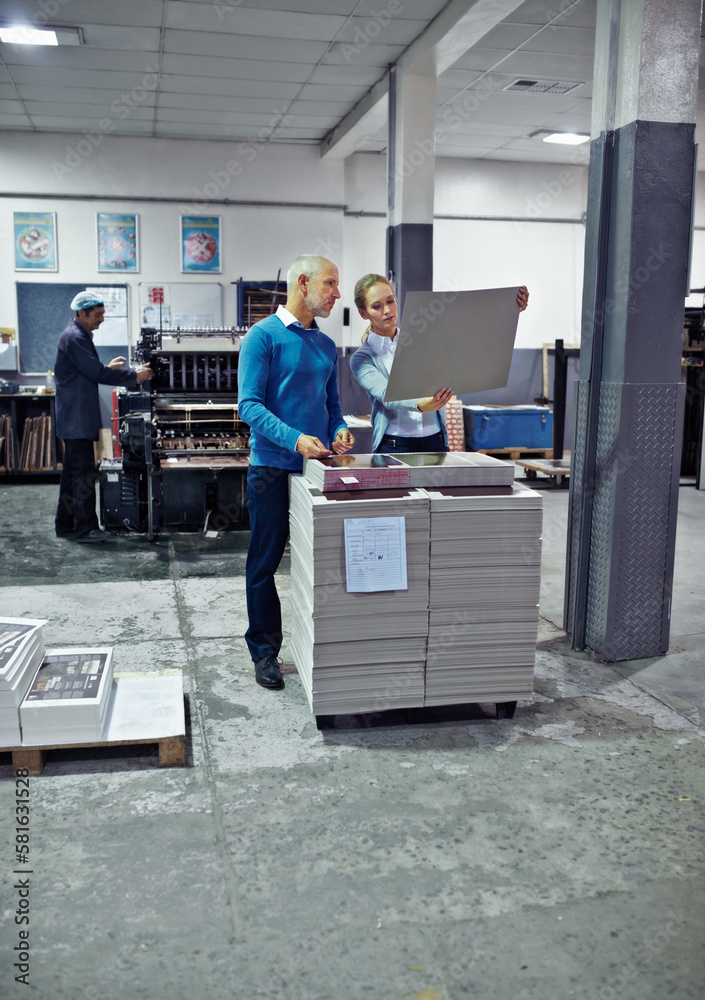 Aufkleber Getting the job done right. two colleagues inspecting inventory in a printing factory.
