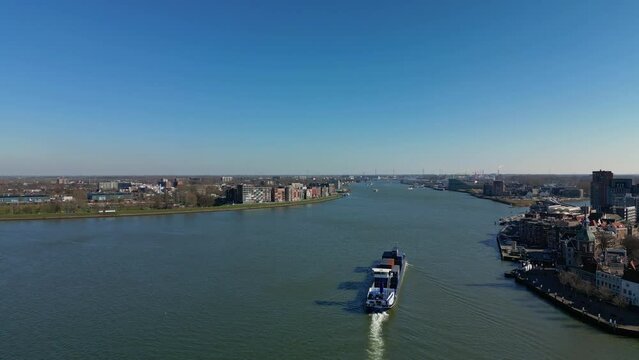 Cargo Inland Ship Transporting Containers Across The River In Dordrecht Netherlands