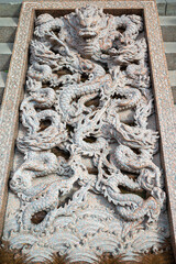 Chinese dragon bas-relief on stairs in Daci buddhist temple in downtown Chengdu, Sichuan province, China - 581637526