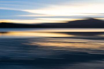 Fototapeta na wymiar Motion blur effect in coastal sunrise for background or conceptual use