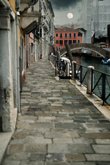 Fototapeta na wymiar Narrow street in Venice Italy