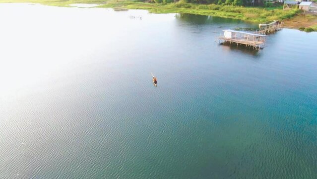 Aerial View of Fishermen Catching Fish in Lake Toba Tourist Area in the morning. Location on Bulbul Beach, Balige, Toba Regency