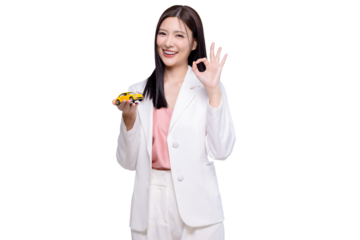 Happy young Asian business look woman shows yellow mock up car with OK hand sign isolated on transparent background, PNG file format.