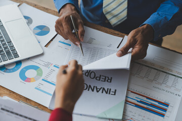 Group of business people, investors analyzing financial reports from documents to calculate income,...