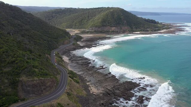 Reverse aerial shot of famous Great Ocean Road near Lorne, Victoria, Australia