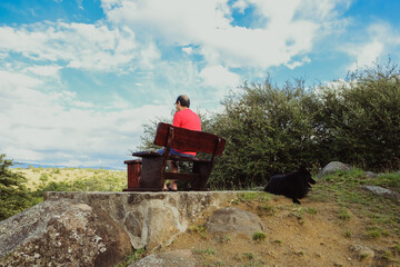 Obraz premium Older man drinking his morning coffee while resting and enjoying the view on the mountains. Beautiful rural landscape