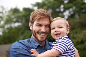 Fototapeta premium Dads pride and joy. young father and his baby boy enjoying a day outside.