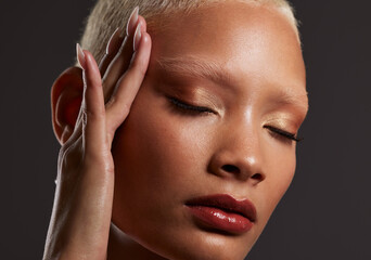 Beauty, makeup and lipstick, face of black woman in dark studio with platinum hair isolated on grey...