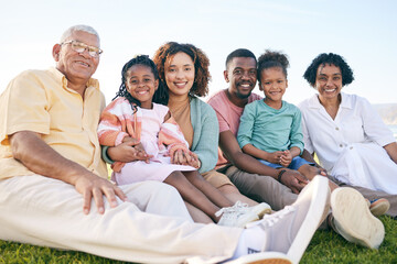 Family, portrait and generations outdoor, happy people relax on lawn with grandparents, parents and...