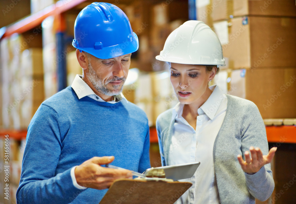 Poster Going over the discrepancies in their figures. two people doing an inventory check in a warehouse.