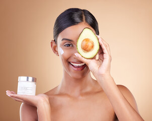 Skincare, avocado and cream with portrait of Indian woman in studio for product, cosmetics and...