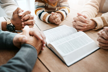 Bible, reading book or hands of big family in prayer, support or hope in Christian home for worship together. Mother, father or grandparents studying, praying or asking God in religion with children