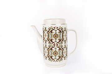 A vintage white teapot with brown pattern isolated on a white background