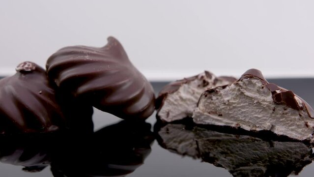 Choco pie chocolate biscuits with marshmallow isolated background Close-up of chocolate coated marshmallows. High quality 4k footage