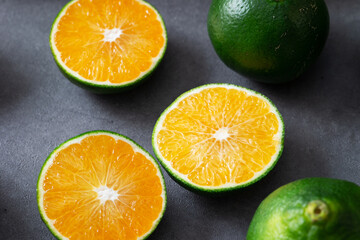 Fresh tangerines and sliced tangerines