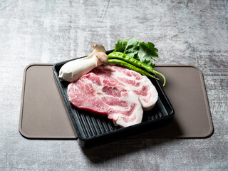 Pork neck, mushrooms and vegetables on a plate