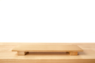 Empty sushi board on wood table with white background. Top view of plank wood for graphic stand product, interior design or montage display your product.
