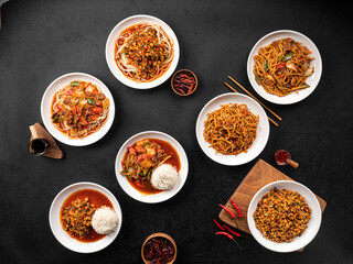 Top view on variety of assorted uyghur lagman dishes table set