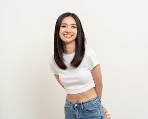 Beautiful smiling happy young asian woman age around 25 in white shirt. Charming female lady standing pose on isolated white background. Asian cute people looking camera confident with backdrop.
