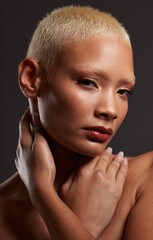 Portrait of black woman, dark studio and makeup, platinum hair and beauty isolated on grey...