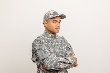 Asian man special forces soldier standing with arms crossed against on the field Mission. Commander...