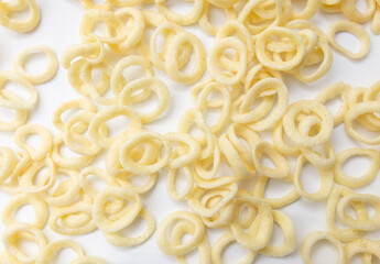 Onion ring chips as a background.