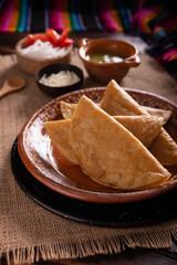 Potato quesadillas. Fried quesadillas made with corn tortillas, they can be filled with any dish or ingredient, such as meat, potato or fish such as marlin or tuna, popular during the Lenten season.