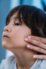 Fototapeta premium Pediatrician Endocrinologist Examining Lymph Nodes of a Preschooler Boy