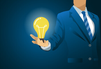 Businessman  holding light bulb in hand.