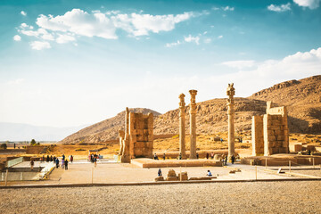 Persepolis, Iran - 8th june, 2022: group of tourist walk by giant column statues. Historical...