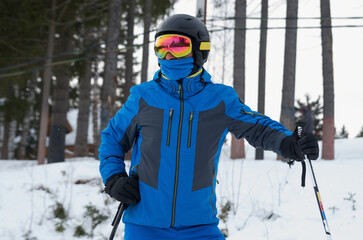 Fototapeta na wymiar Close-up of a skier in a sports helmet and ski goggles