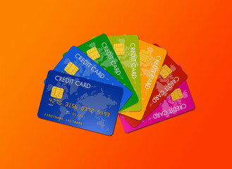Colorful credit cards isolated on an orange background