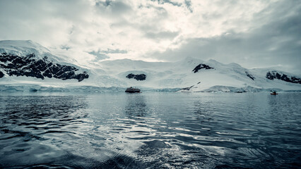 Water Level Seascape in Antarctica of Snow Covered Mountains Reflecting on Water, Scenic