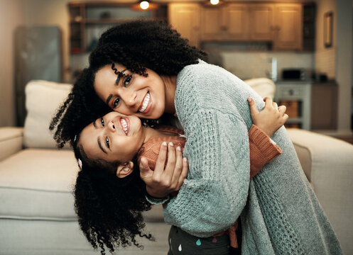 Family, portrait or happy child hug mother for Mothers Day, home bonding or embrace in house living room. Care, love or playful mom, mama or woman with female youth kid, girl or daughter in apartment