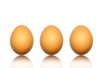 Close up of three brown chicken eggs with reflect isolated on white background. easter egg. Triple hen raw eggs with reflect shadow. Natural nutrition food. Healthy ingredient meal protein product.