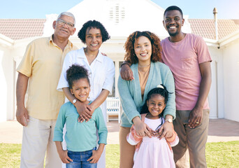 Happy portrait of an interracial family outside house with a smile, happiness and care on the lawn....