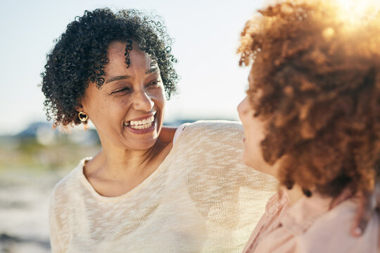 Family, Mom And Adult Daughter Hug With Smile And Happiness Outdoor, Travel And Adventure On Vacation. People At Beach, Happy Women And Love, Care And Support, Relationship And Freedom In The Sun