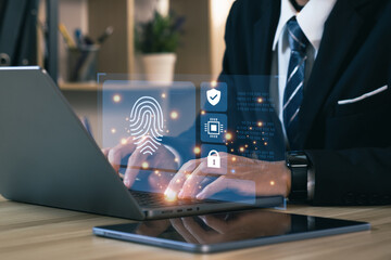 Businessmen using a computer to cyber security digital technology, business people use fingerprints to access personal cybersecurity, keeping users' personal information safe. Concept of surveillance.