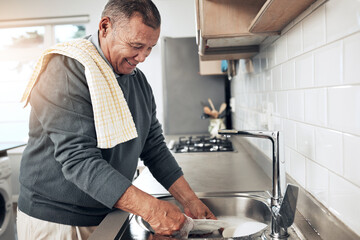 Cleaning, washing dishes or happy old man with soap and water in the kitchen sink in healthy home. Dirty, messy or senior person with liquid foam to disinfect, protect and prevent bacteria or germs