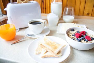 Breakfast. Oatmeal, coffee, bread, butter. In the kitchen. Morning