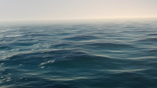 CGI Of Calm Blue Waves On A Misty Morning. Seamless Loopable Animation