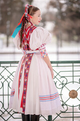 Beautiful woman wearing traditional Eastern Europe folk costumes. Slovak folk costumes.