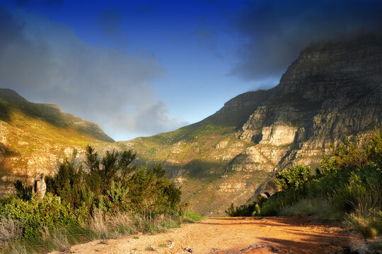 Follow the road to a South African adventure. A dirt road leadng through the mountians in South Africa.