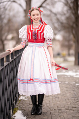 Beautiful woman wearing traditional Eastern Europe folk costumes. Slovak folk costumes.