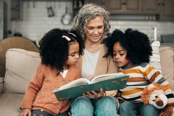 Family children, book and grandma reading fantasy storybook, story or bond on home living room sofa. Love, grandma babysitting and elderly woman with child development for biracial kindergarten kids - Powered by Adobe