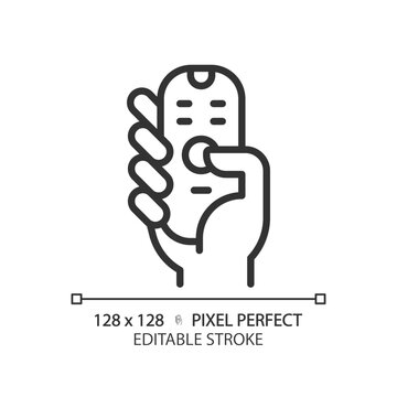 Hand with remote control pixel perfect linear icon. Digital device with keys. Contactless infrared gadget. Thin line illustration. Contour symbol. Vector outline drawing. Editable stroke