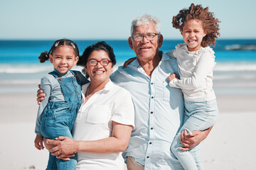 Portrait, travel and happy family at a beach, bonding and having fun outdoors against sea...